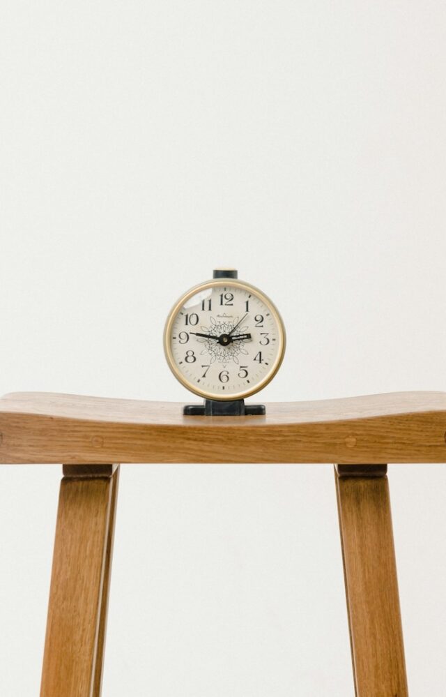 brown wooden table clock at 10 10